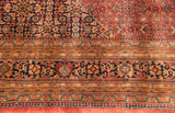 Section of a 10x14 vintage Indian Bijar carpet featuring intricate floral and geometric patterns in deep navy, rust, and beige tones with layered ornamental borders.