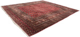 Large vintage Bokhara carpet with a deep red center and intricate brown border patterns, displayed at a slight angle on a white background.