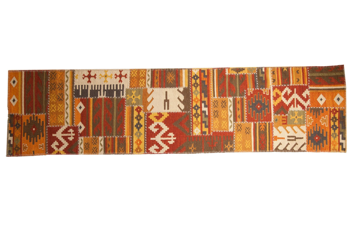 3x11.5 New Patchwork Kilim Rug Runner displaying geometric patchwork with warm reds, yellows, and olive tones