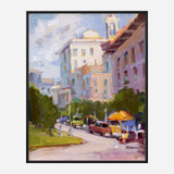 Impressionist-style city street scene with trees, cars, and a yellow-orange vendor stand under a partly cloudy sky, framed in black.