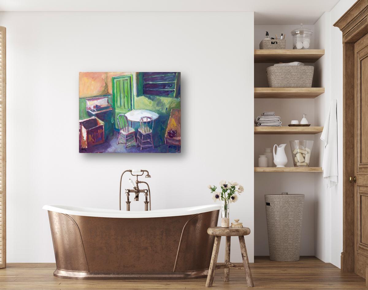 Abstract painting above a bronze freestanding bathtub in a bright bathroom, featuring bold green, purple, and peach colors with a round table and chairs scene.