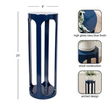 Tall, narrow drink table with high gloss navy blue finish and arched open wood construction, measuring 23 inches high and 8 inches wide.