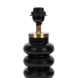 Black ceramic lamp base with three rounded stacked rings and a brass collar beneath the socket holder, shown against a white background.