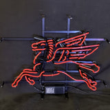 Red neon tubing shaped into a stylized flying horse mounted on a black metal frame with visible support bars, against a dark background.