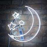 Illuminated Moon and Stars Neon Light Sign with acrylic backing hanging on a wall