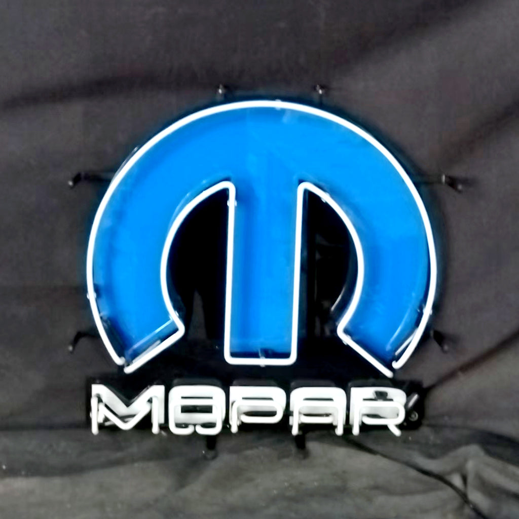 Blue and white neon Mopar logo light with a stylized 'M' shape above the word 'Mopar' in white neon, mounted on a black background.