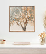 Impressionistic tree painting with soft blue, beige, and brown brushstrokes, framed with a beaded wooden frame, hanging above a minimalist white shelf with dried plants.
