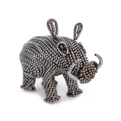 Metal Shaving Warthog sculpture showing finely detailed metal texture and form in shades of rusted and polished metal.