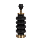 Table lamp base with five stacked glossy black rounded rings, supported by brass accents at top and bottom, photographed on a white background.