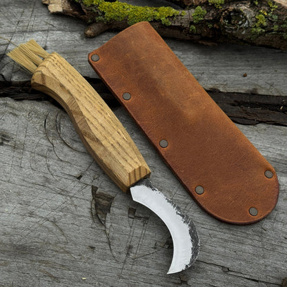 Mushroom knife with carbon steel blade, ash wood handle, and built-in brush, shown with leather sheath