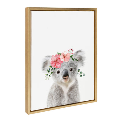 Sylvie Flower Crown Koala framed canvas art with a koala wearing a pink and purple flower crown on a light background in a bright gold frame