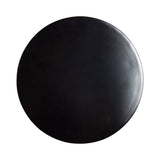 Top view of a round black metal table top with a smooth surface and subtle texture variations.