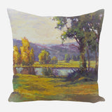 Square pillow featuring an impressionist landscape with a reflective pond, green grass, yellow and green trees, and a softly lit cloudy sky.