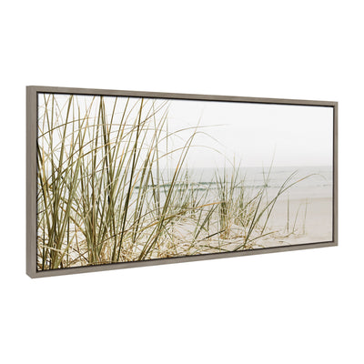 Framed canvas art showcasing calm beach grass in neutral colors with a modern floating frame