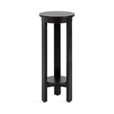 Tall black round wood side table with three straight legs and a lower circular shelf connecting the legs near the base.