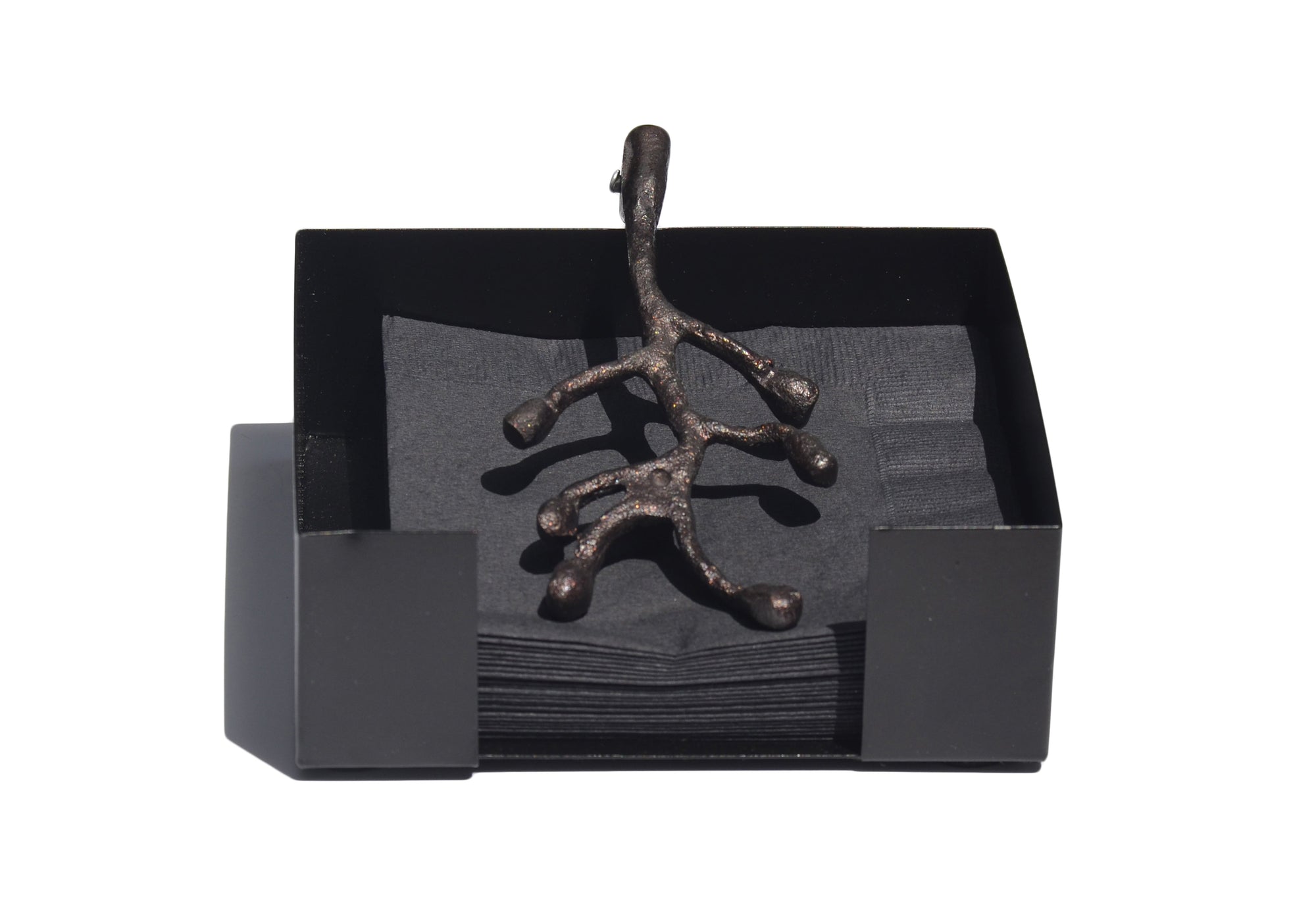 Vibhsa napkin holder featuring an antique flower bud design displayed on a wooden table