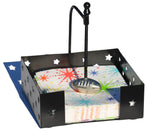 Black metal square napkin holder with star cutouts and a silver football-shaped handle securing colorful star-patterned napkins inside.