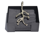 Silver Vibhsa Napkin Holder with antique flower bud design on a dining table