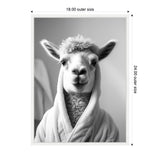 Black and white photo of a llama wearing a plush bathrobe, centered and facing forward against a plain background, framed in white with dimensions 18x24 inches.