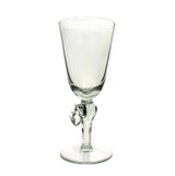 Clear glass wine glass with a stem shaped like a detailed rhinoceros, standing on a round flat base, against a plain white background.