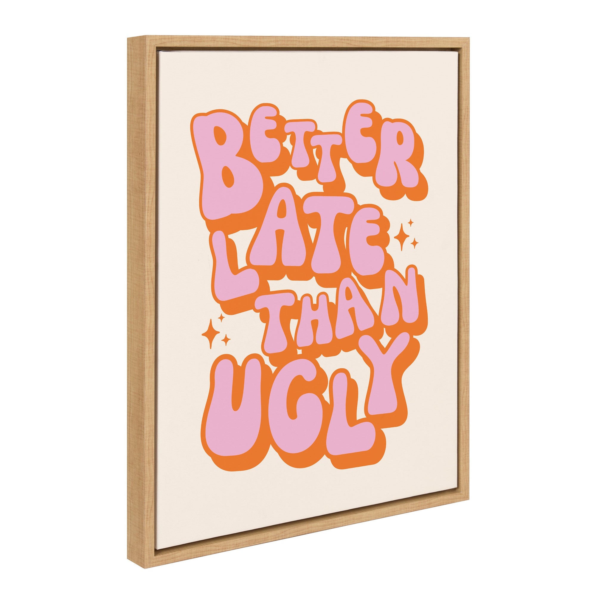 Framed canvas art with the quote 'Better Late Than Ugly' in pink and orange letters on white background