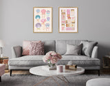 Two framed canvases above a gray sofa, one showing colorful sea shells and jellyfish, the other featuring vintage matchbox and bow illustrations, in a neutral living room.
