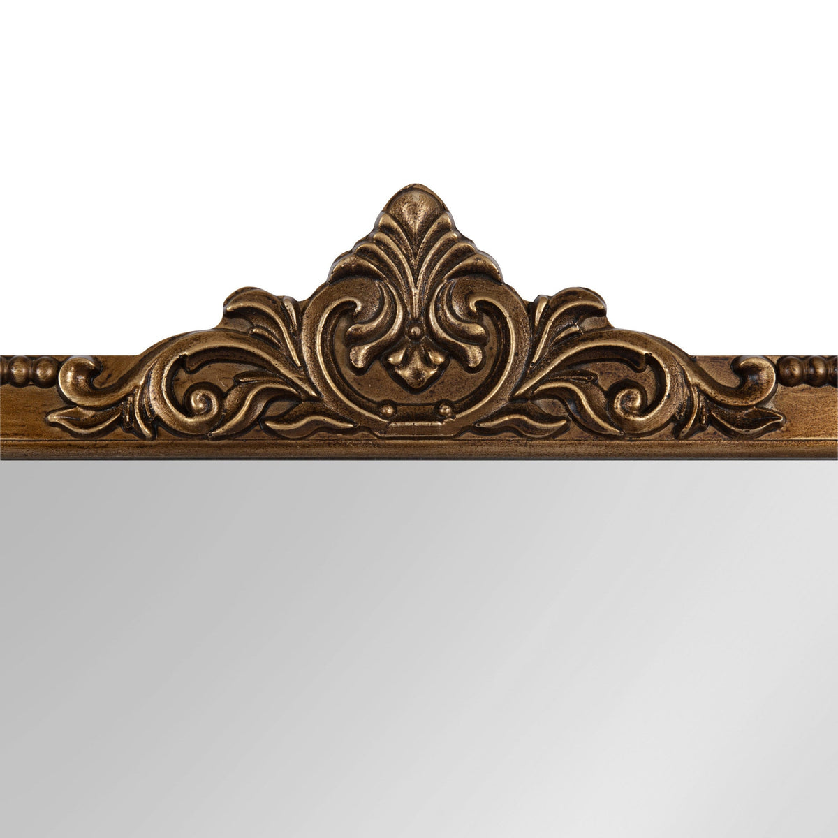 Top section of an arched wall mirror with an ornate bronze-colored frame featuring a symmetrical leaf and scroll design.