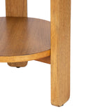 Close-up of a round wooden side table's leg and lower shelf with a smooth, natural wood grain finish in warm brown tones.