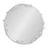 Round wall mirror with a thin silver metal frame adorned with delicate floral, leaf, and butterfly decorations evenly spaced around the edge.