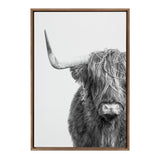 Black and white framed canvas portrait of a Highland cow with long shaggy hair covering its eyes and a prominent left horn, against a plain light background.