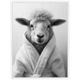 Black and white portrait of a sheep facing forward, dressed in a soft, textured bathroom robe with its fluffy wool visible around the collar.