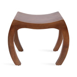Curved wooden stool with broad, arching legs and a concave seat, showcasing smooth, warm brown wood grain and minimalist design.
