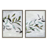 Two framed canvas artworks each featuring abstract branches with green, blue, and brown leaves against a textured white and gray background, by Nikita Jariwala.