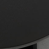 Close-up of a round black wood table surface with subtle wood grain texture and smooth curved edge detail.