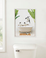 Three playful penguins in and around a vintage-style clawfoot bath, with tropical banana leaves framing the scene against a textured pale backdrop.