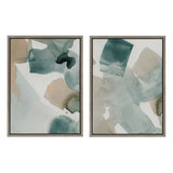 Two abstract watercolor canvases with overlapping green, teal, beige, and brown translucent shapes in dark gray thin frames, displayed side by side on a white background.