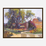 Impressionist painting of a sunlit desert garden with large trees, a bench, colorful flowers, and a small adobe chapel topped with a cross under a pale sky.