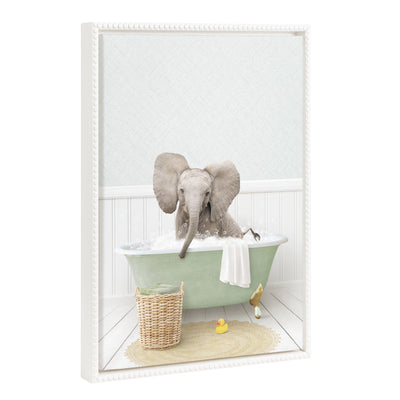Framed canvas art showing a whimsical baby elephant with big ears in a cottage bath setting, framed with a white vintage beaded polystyrene frame.