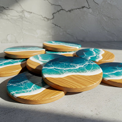 Set of 4 handmade ocean resin coasters with natural wood and blue epoxy waves, displayed with metal holder