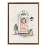 Framed painting of a pink Christmas door adorned with a green wreath, a potted pine tree on the left, and a cardboard box with greenery on the right beneath a black lantern.
