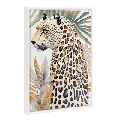 Framed canvas wall art of a fern and cheetah design with a gold beaded vintage frame hung on a green wall
