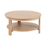 Round wooden coffee table with a light natural finish, featuring a lower circular shelf and three vertical supports evenly spaced around the edges.