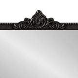 Top section of a rectangular mirror with an ornate dark brown frame featuring a central decorative carved scroll design and beaded edge detail
