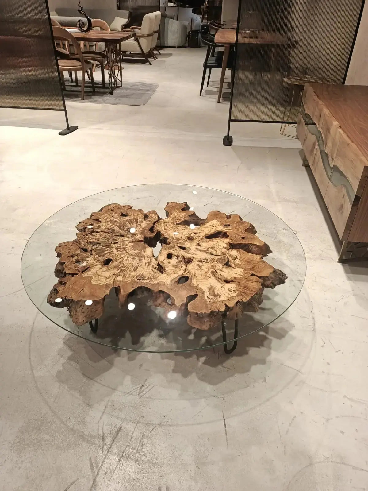 Olive wood rustic coffee table with clear glass top and stone-inspired wooden legs