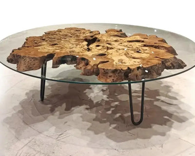 Olive wood rustic coffee table with clear glass top and stone-inspired wooden legs
