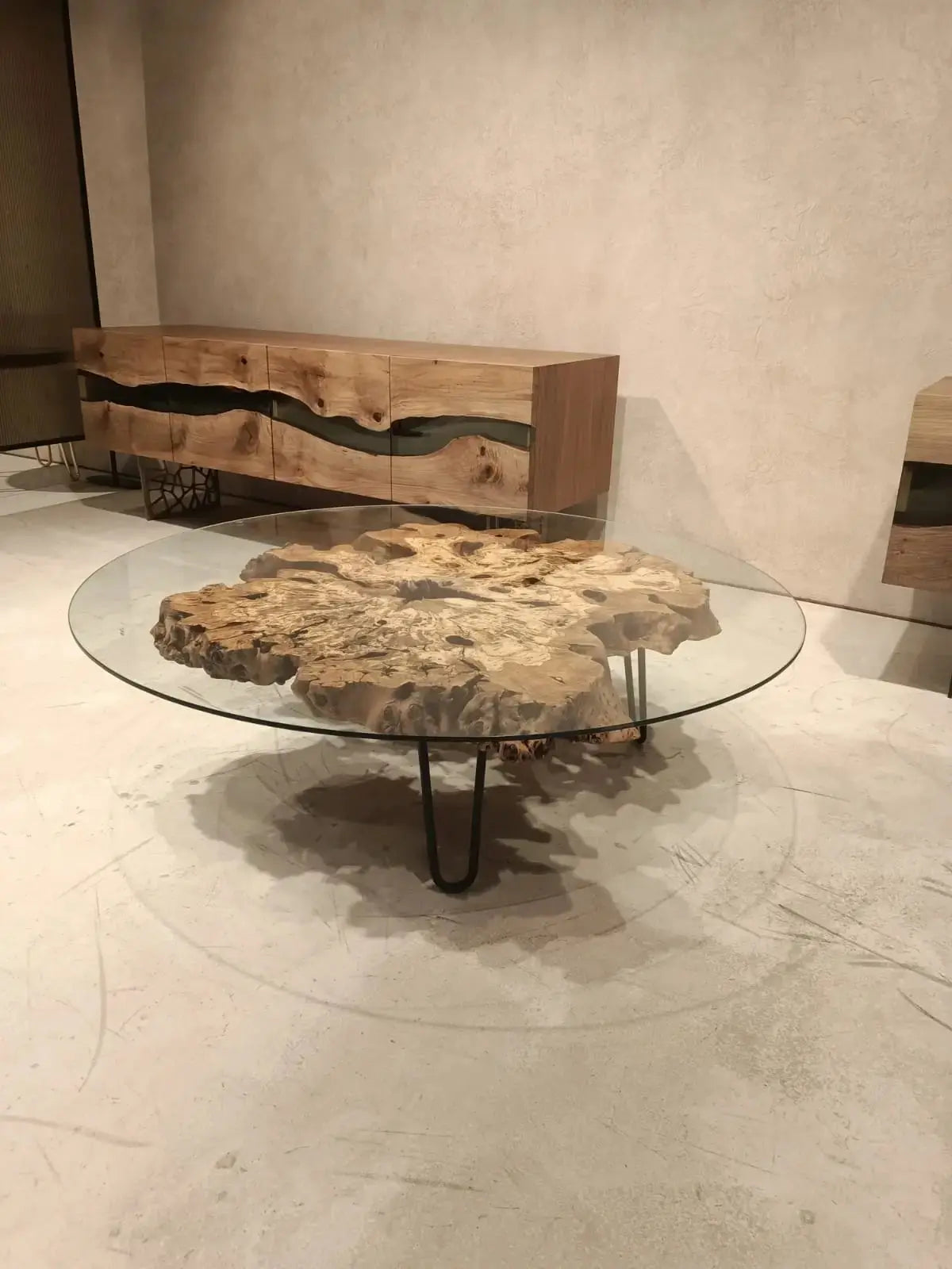 Olive wood rustic coffee table with clear glass top and stone-inspired wooden legs