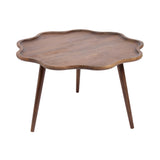 Alezar scallop wood coffee table with scalloped tabletop and tapered legs in a room setting
