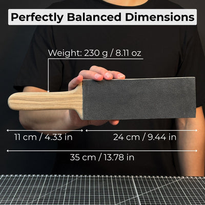 One-sided leather strop with oak base and green polishing compound for knife sharpening