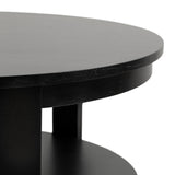 Close-up of a round black wood coffee table showing its smooth top and lower circular shelf connected by vertical supports.