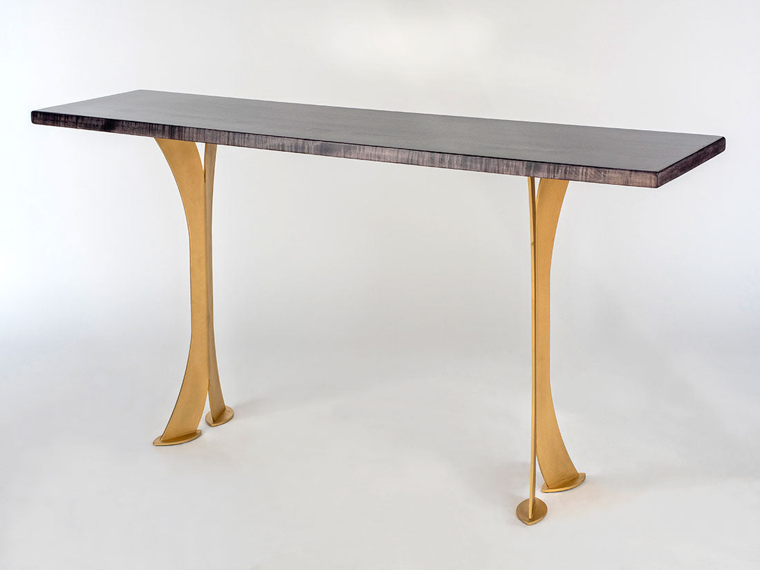 Split Leg Sofa Table with black stained Tiger Maple top and matte gold split steel legs